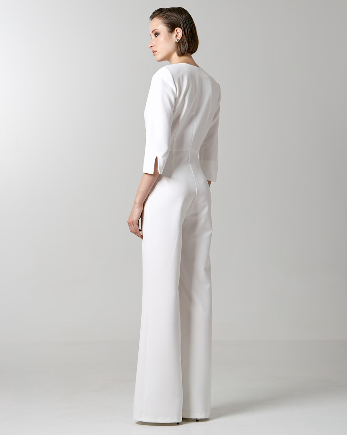 Jumpsuit with monogram buttons in white