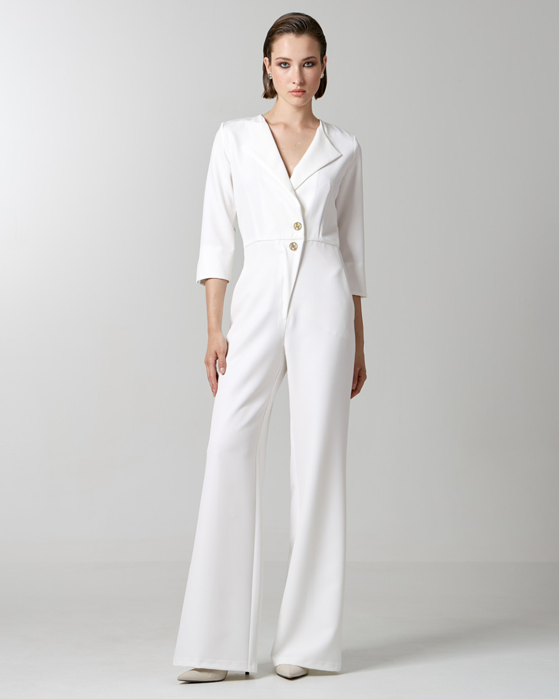 Jumpsuit with monogram buttons in white
