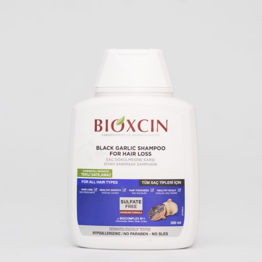 Bioxcin - Шампоан против  косопад с черен чесън  / 300 мл