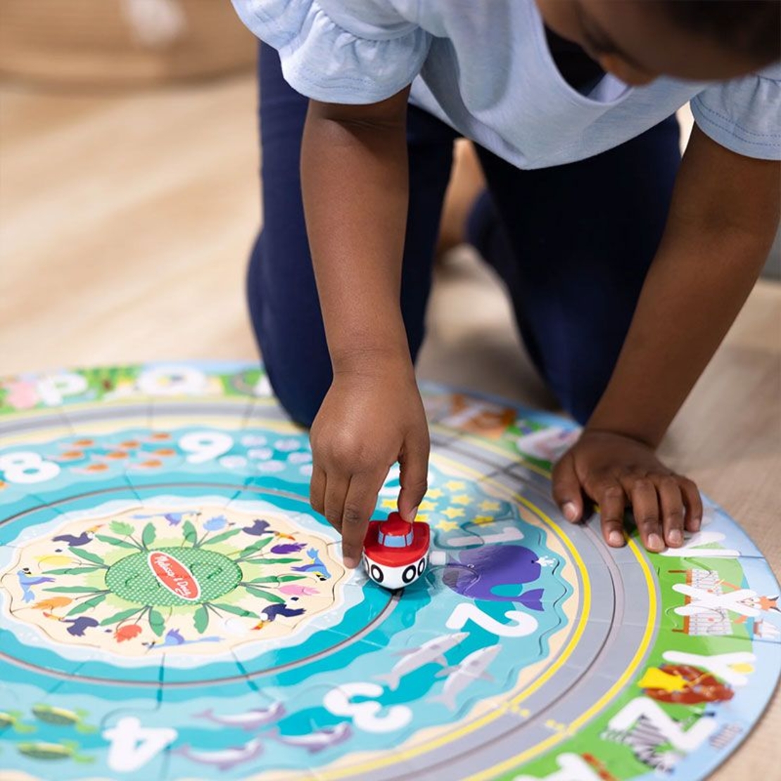 Детски пъзел за земя Melissa and Doug Round the Shore с превозни средства, 48 части
