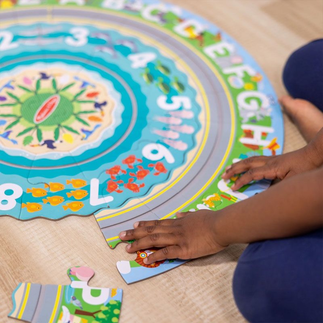 Детски пъзел за земя Melissa and Doug Round the Shore с превозни средства, 48 части