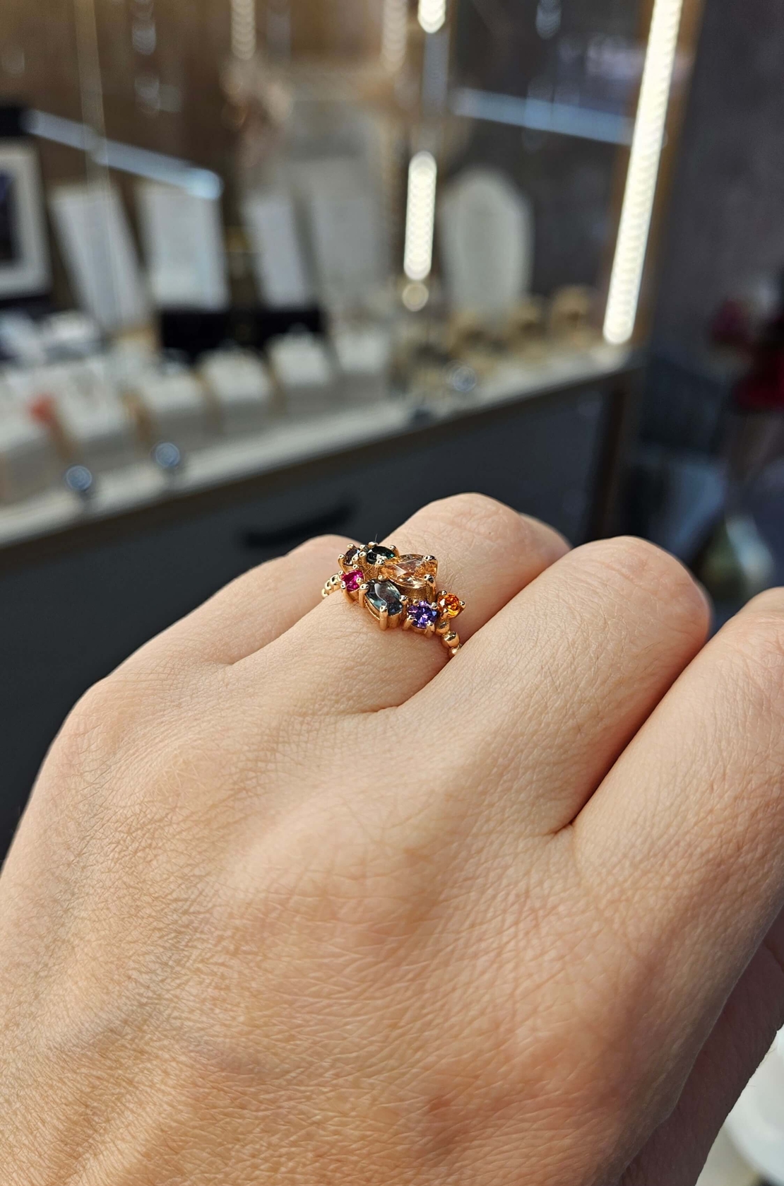 Златен пръстен от розово злато и цветни циркони