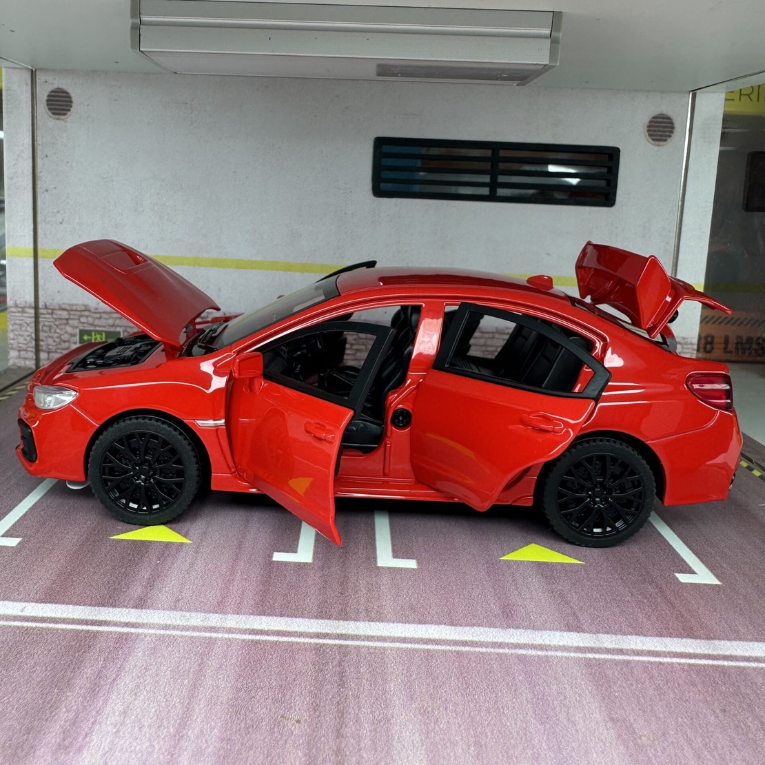 Метална кола с отварящи се врати капаци светлини и звуци Subaru Impreza 1:32