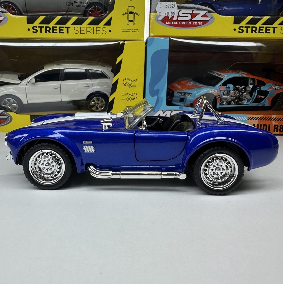 Метална кола с отварящи се врати капаци светлини и звуци Ford Shelby Cobra 427 1:24