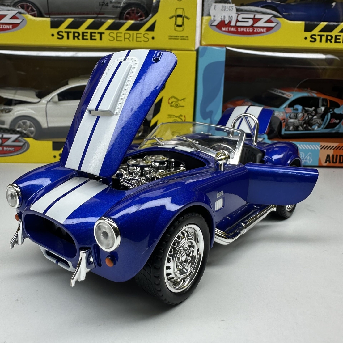 Метална кола с отварящи се врати капаци светлини и звуци Ford Shelby Cobra 427 1:24