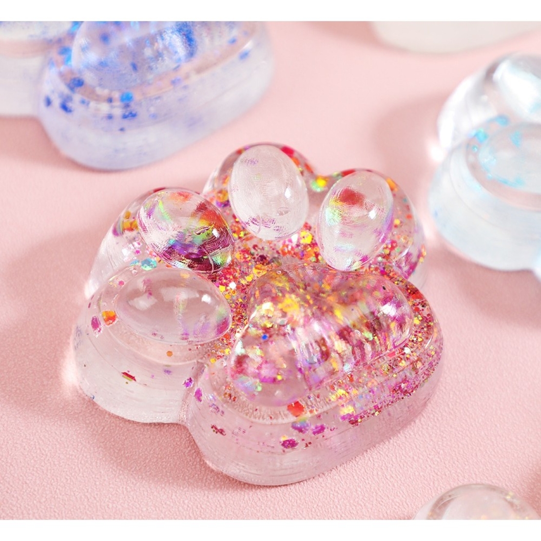Jucarie Antistres Squishy, Flippy, cu Revenire Lenta, Squeeze Pinch Family, Model Cat Paw, 6.5 x 7 cm, din Tpr, 4-6 Ani, Model 4 Sclipici, Transparent