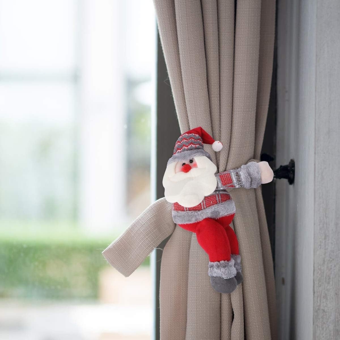 Clema pentru perdea, prindere cu arici, model Mos Craciun, material textil/poliester, 53 x 23 cm, multicolor