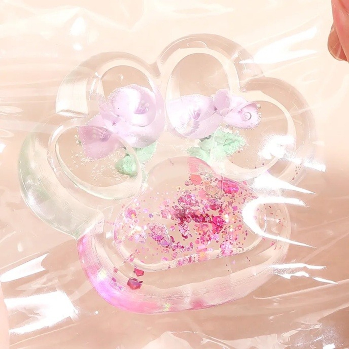 Jucarie Antistres Squishy, Flippy, Labuta de Pisica Pufoasa, cu Revenire Lenta, 7 x 6.5 cm, Model Flori 1, Transparent