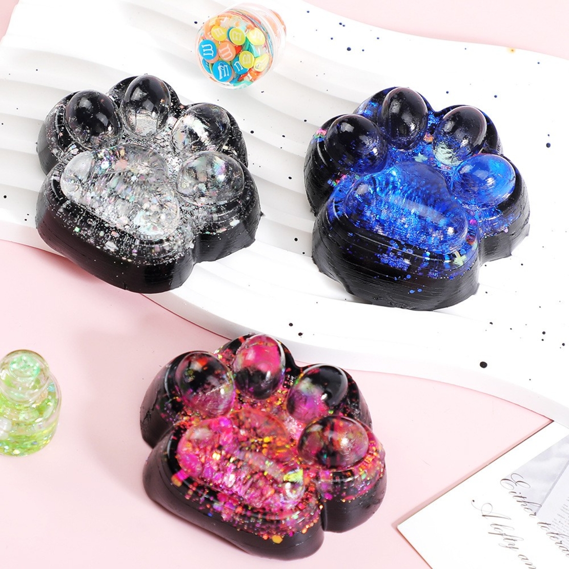 Jucarie Antistres Squishy, Flippy, cu Revenire Lenta, Squeeze Pinch Family, Model Labuta de Pisica cu Sclipici, 6.5x6 cm, 60g, Ambalaj Transparent, Albastru-Negru