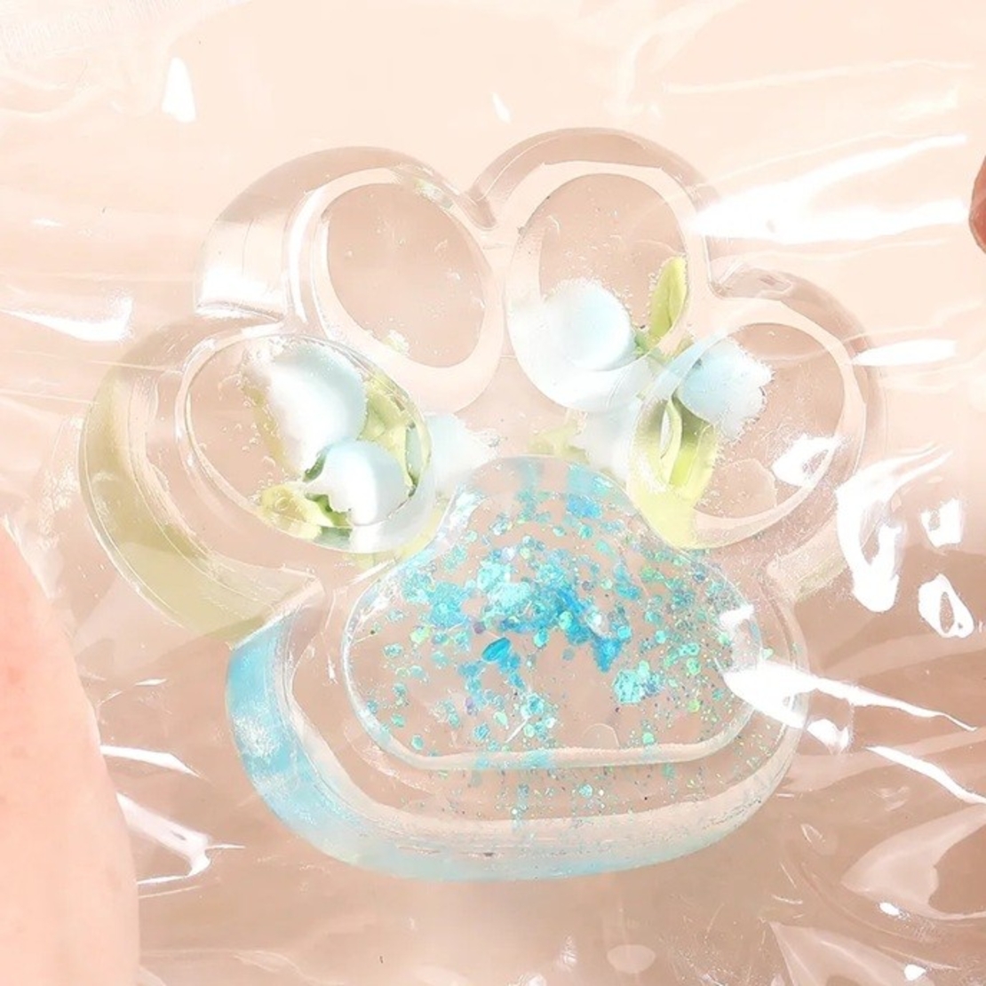 Jucarie Antistres Squishy, Flippy, Labuta de Pisica Pufoasa, cu Revenire Lenta, 7 x 6.5 cm, Model Flori 1, Transparent