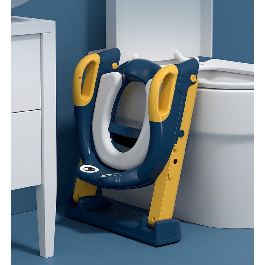 Reductor si Scaunel Inaltator WC, Flippy, pentru Copii 1 - 7 Ani, 2 Trepte Reglabile, Pliabil, Colac Moale, cu Spatar si Manere, Inaltime 54/58 cm x 39.5 x 35 cm, din Plastic+PVC, Albastru/Portocaliu